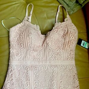 Size 8 coral color dress two straps. With flare at bottom form